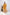 Woman wearing a yellow outfit standing in a minimalistic setting with white background and decorative elements. Freo